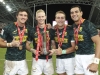 South Africa's Impi Visser, Ryan Oosthuizen, James Murphy, and Chris Dry with the Singapore Cup trophy after the win over Fiji on day two of the HSBC World Rugby Sevens Series in Singapore on 14 April, 2019. Photo credit: Mike Lee - KLC fotos for World Rugby