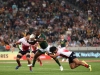 South Africa captain Siviwe Soyizwapi drives through the Japan defense on day one of the HSBC Cape Town Sevens 2019 men's competition on 13 December, 2019. Photo credit: Mike Lee - KLC fotos for World Rugby