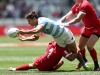 Argentina's Rodrigo Etchart offloads against the Wales defense on day two of the HSBC Cape Town Sevens 2019 men's competition on 14 December, 2019. Photo credit: Mike Lee - KLC fotos for World Rugby