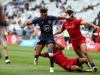 Scotland's Femi Sofolarin drives through the Spain defense on day two of the HSBC Cape Town Sevens 2019 men's competition on 14 December, 2019. Photo credit: Mike Lee - KLC fotos for World Rugby